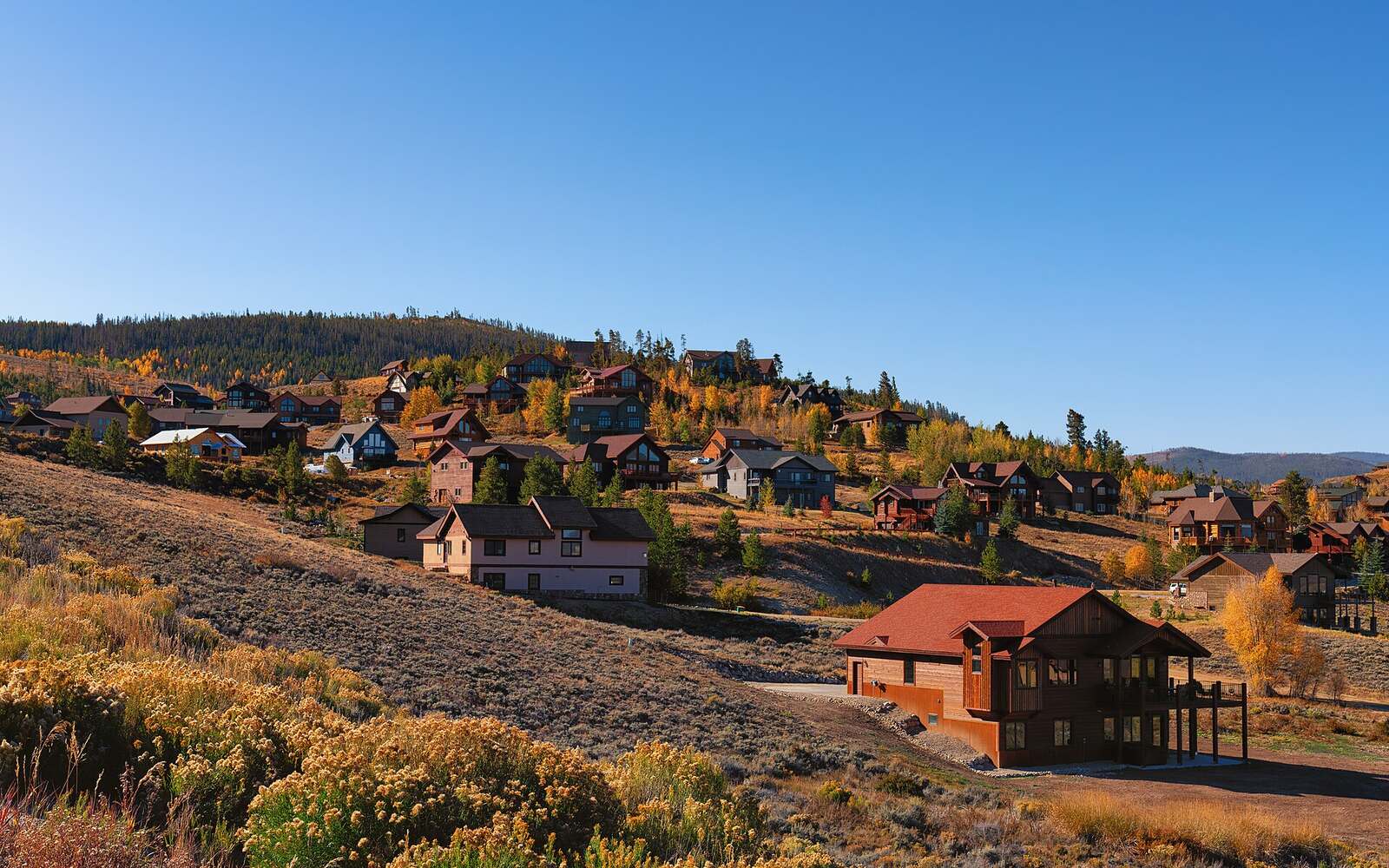Mountain homes on a hillside in Granby, Colorado, in autumn